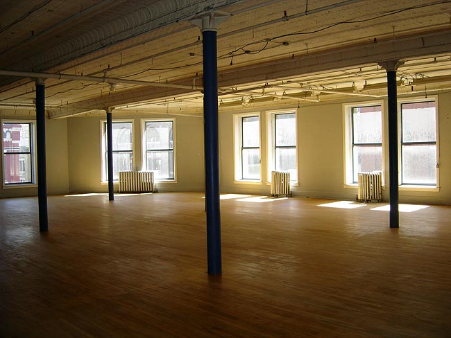 Large open space with exposed hardwood